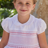 Little English traditional girl's clothing, classic smocked dress for toddler girls with peter pan collar and sash, little girl's flower girl dress with light pink smocking