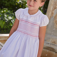 Little English traditional girl's clothing, classic smocked dress for toddler girls with peter pan collar and sash, little girl's flower girl dress with light pink smocking