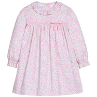 Little English traditional children's clothing. Long sleeve dress in pink and green floral with ruffle collar and fixed pink bow across the chest for little girls