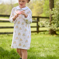 Little English traditional children's clothing. Long sleeve pumpkin floral print cotton knit dress with white peter pan collar and green piping detail for little girls.