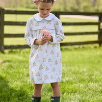 Little English traditional children's clothing. Long sleeve pumpkin floral print cotton knit dress with white peter pan collar and green piping detail for little girls.