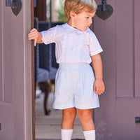 Little English traditional children's clothing. Toddler boy's dressy blue and white short set with white shirt and blue shorts for Spring. Special occasion outfit for little boys