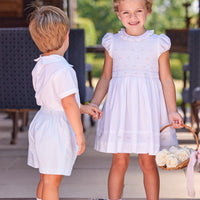 Little English traditional children's clothing. White special occasion outfits for little ones
