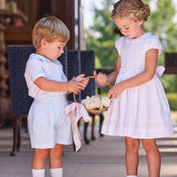Little English traditional children's clothing. White special occasion outfits for little ones