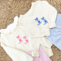 Little English cream intarsia sweaters with cowboy boots in pink and blue