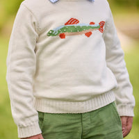 Little English traditional children's clothing. Boys cream crew neck sweater with fish motif layered over light blue striped polo and paired with watercress green corduroy pants.