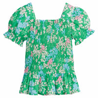 Little English traditional children's clothing. Green, pink and blue floral print blouse for girl's for spring.
