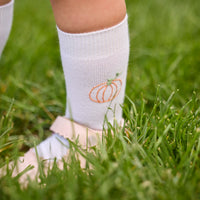 Little English classic children's clothing. White cotton knee high socks with pumpkin embroidery for little boys and girls.