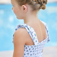 Little English traditional children's clothing. Blue and red floral print dress for girls for Summer. 4th of July outfit for little girls