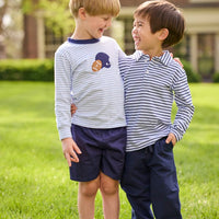 Little English traditional children's clothing. Light blue and navy Winslow Stripe long sleeve polo shirt paired with navy essential jogger. Light blue stripe long sleeve applique t-shirt with football and helmet applique paired with navy twill basic shorts.