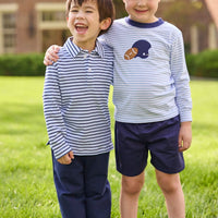 Little English traditional children's clothing. Light blue and navy Winslow Stripe long sleeve polo shirt paired with navy essential jogger. Light blue stripe long sleeve applique t-shirt with football and helmet applique paired with navy twill basic shorts.