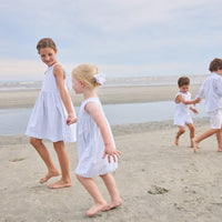 Little English traditional children's clothing. Light blue and white striped sleeveless dress with white ricrac trim for little girls