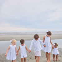 Little English traditional children's clothing. Light blue and white striped two-piece for baby girls with white ricrac trim