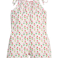 Little English traditional children's clothing. White romper with red and pink tulip print and self-tie straps for little girls