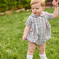 Little English traditional children's clothing. Short sleeve peter pan bubble in brown, blue, and pink Wilmington Plaid for baby boys with button tabs and corduroy piping.
