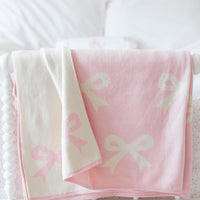 Little English giftable nursery accessory, reversible knit nursery blanket with light pink and cream bow print