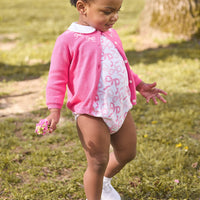 little english classic children's clothing baby girls essential cardigan in hot pink with embroidered white bows around neck, long sleeve bubble with all over pink bows print with peter pan collar, fall outfit for girls