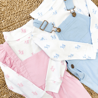 Little English cowboy boot printed turtlenecks and coordinating outfits in pink and blue