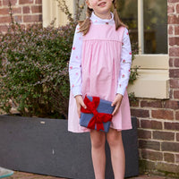 Little English classic children's clothing. White knit turtleneck with holiday present print layered under light pink corduroy Madison Jumper. Holiday outfit for little boys and girls.