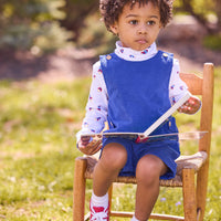 little english classic children's clothing white turtleneck with blue and red rocket print, button tab john john in royal blue corduroy, fall outfit for boy