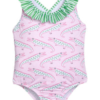 Little English traditional children's clothing. Pink swimsuit with green striped ruffled top and alligator pattern for little girls