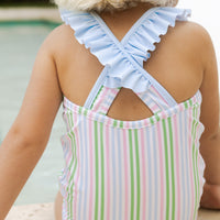 Little English traditional children's clothing. Pink, green, and blue striped swimsuit with blue ruffled top and for little girls