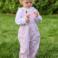 Little English traditional children's clothing. Light pink and green floral overall with ruffle detailing layered over white knit smocked Madeline Blouse in light pink