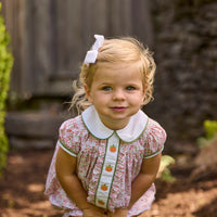 Little English classic children's clothing. Pink and green floral set for baby girls. Puff sleeve top with white peter pan collar and placket with pumpkin embroidery paired with matching ruffled bloomer.