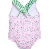 Little English traditional children's clothing. Pink swimsuit with green striped ruffled top and alligator pattern for little girls