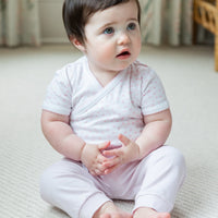 Little English traditional children's clothing. Set of 3 knit onesies in light pink stripe, light pink, and white with light pink stars. Light pink jogger set for baby girls