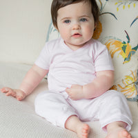 Little English traditional children's clothing. Set of 3 knit onesies in light pink stripe, light pink, and white with light pink stars. Light pink jogger set for baby girls