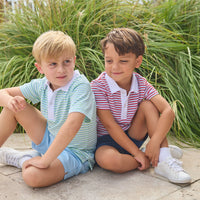 Little English classic short sleeve polo in blue, green, and white greenview stripe and red, white, and blue americana stripe. Sport short in light blue and navy. For little boy