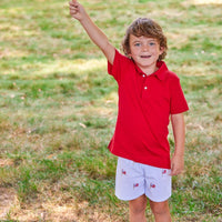 Little English traditional children's clothing. Boy's blue and white seersucker short with embroidered flags for summer. 4th of July shorts for boys