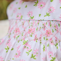 Little English traditional children's clothing. White sleeveless smocked bubble with pink and green florals for baby girls