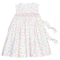 Little English traditional children's clothing. White sleeveless smocked dress with pink and green florals for little girls
