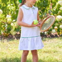 Little English traditional children's clothing. White sleeveless polo dress with green trim for girls for Spring. White and green tennis dress for girls