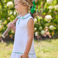Little English traditional children's clothing. White sleeveless polo dress with green trim for girls for Spring. White and green tennis dress for girls