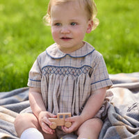 Little English classic children's clothing. Smocked peter pan bubble in tan and blue Durham windowpane with blue piping for baby boys