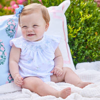 Little English traditional children's clothing. Smocked pima cotton knit bubble with bow and flower print for baby girls for Spring