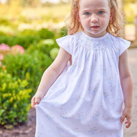 Little English traditional children's clothing. Smocked pima cotton knit dress with bow and flower print for little girls for Spring