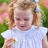 Little English traditional children's clothing. Smocked pima cotton knit dress with bow and flower print for little girls for Spring