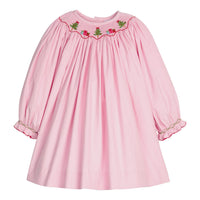 Little English traditional children's clothing. Long sleeve pink corduroy dress with Christmas motif smocking around the neckline for little girls.