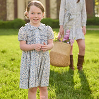 Little English traditional children's clothing. Capped sleeve blue, brown, and cream floral smocked dress with peter pan collar for little girls.