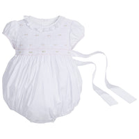 Little English traditional children's clothing. Dressy white bubble with floral smocking for baby girls for Spring. Special occasion outfit for baby girl