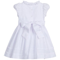 Little English traditional children's clothing. Dressy white dress with floral smocking for little girls for Spring. Special occasion outfit for toddler girl