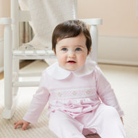 little english baby girl smocked footie with pink geo design and white peter pan collar