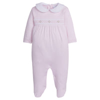 little english baby girl smocked footie with pink geo design and white peter pan collar