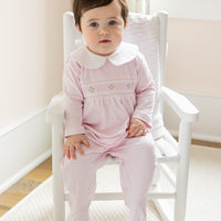 little english baby girl smocked footie with pink geo design and white peter pan collar
