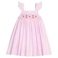 Little English traditional children's clothing. Light pink seersucker gingham dress for little girls with flutter sleeves and strawberry smocking across the chest