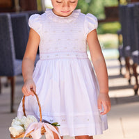 Little English traditional children's clothing. Dressy white dress with floral smocking for little girls for Spring. Special occasion outfit for toddler girl